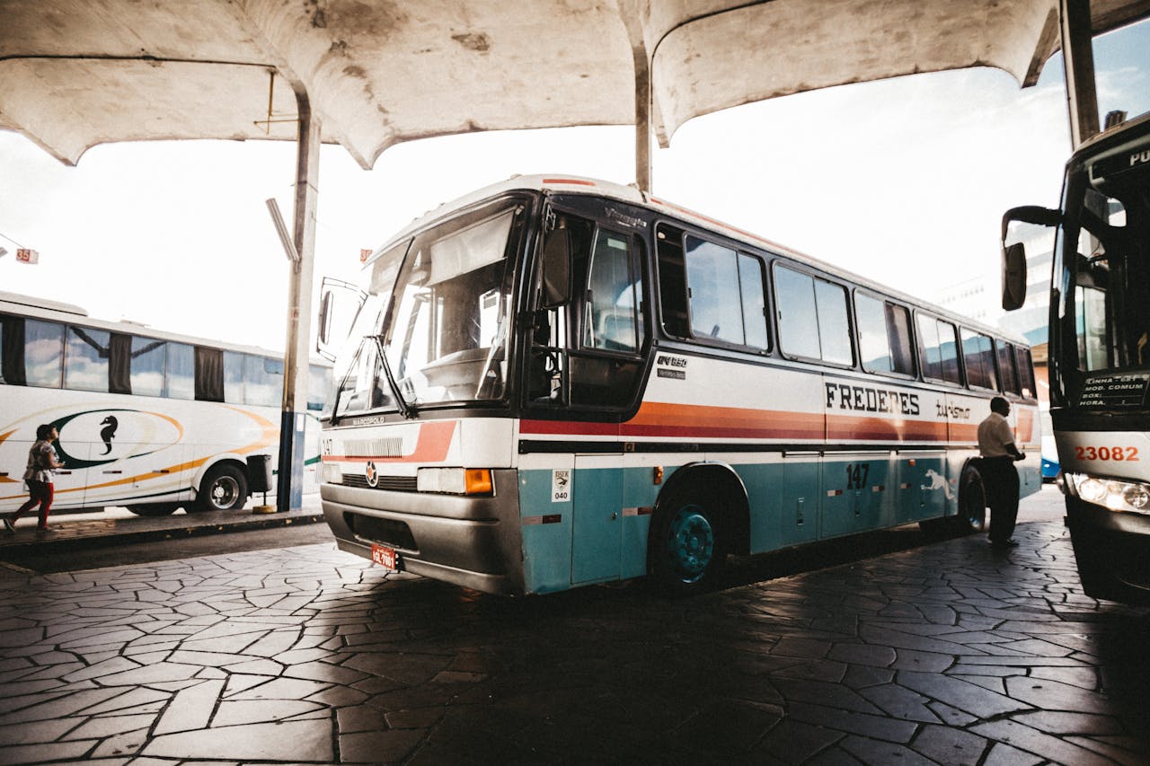 services-03 Colorful bus at an outdoor station captures transportation dynamics.
